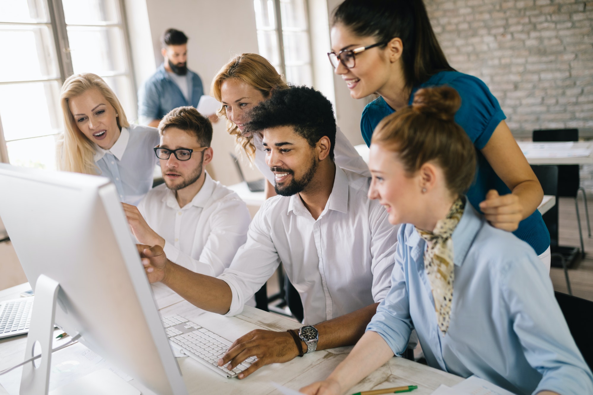 successful-happy-group-of-people-learning-software-engineering-and-business-during-presentation-2.jpg